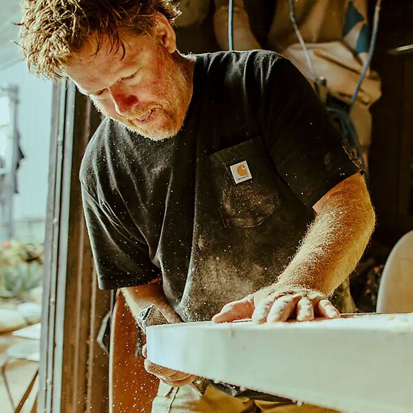 Man at work wearing Carhartt Short-Sleeve Pocket T-Shirt with Cal Fire Logo